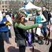 Sterling 411 employee Lauren Felcher hands out free bottle openers, sunglasses and frisbees on the Michigan campus during Bash on the Diag on Sunday, March 17. Daniel Brenner I AnnArbor.com